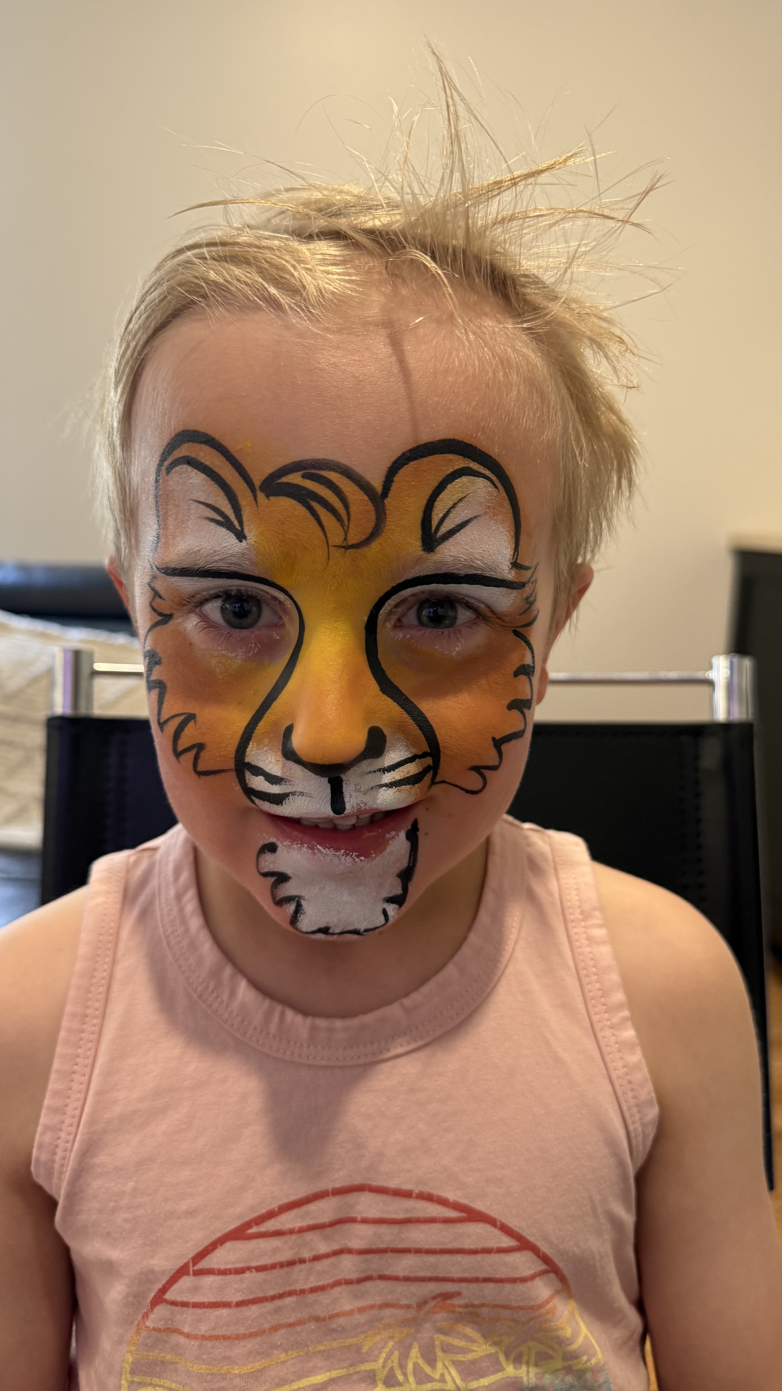 Child with tiger face paint