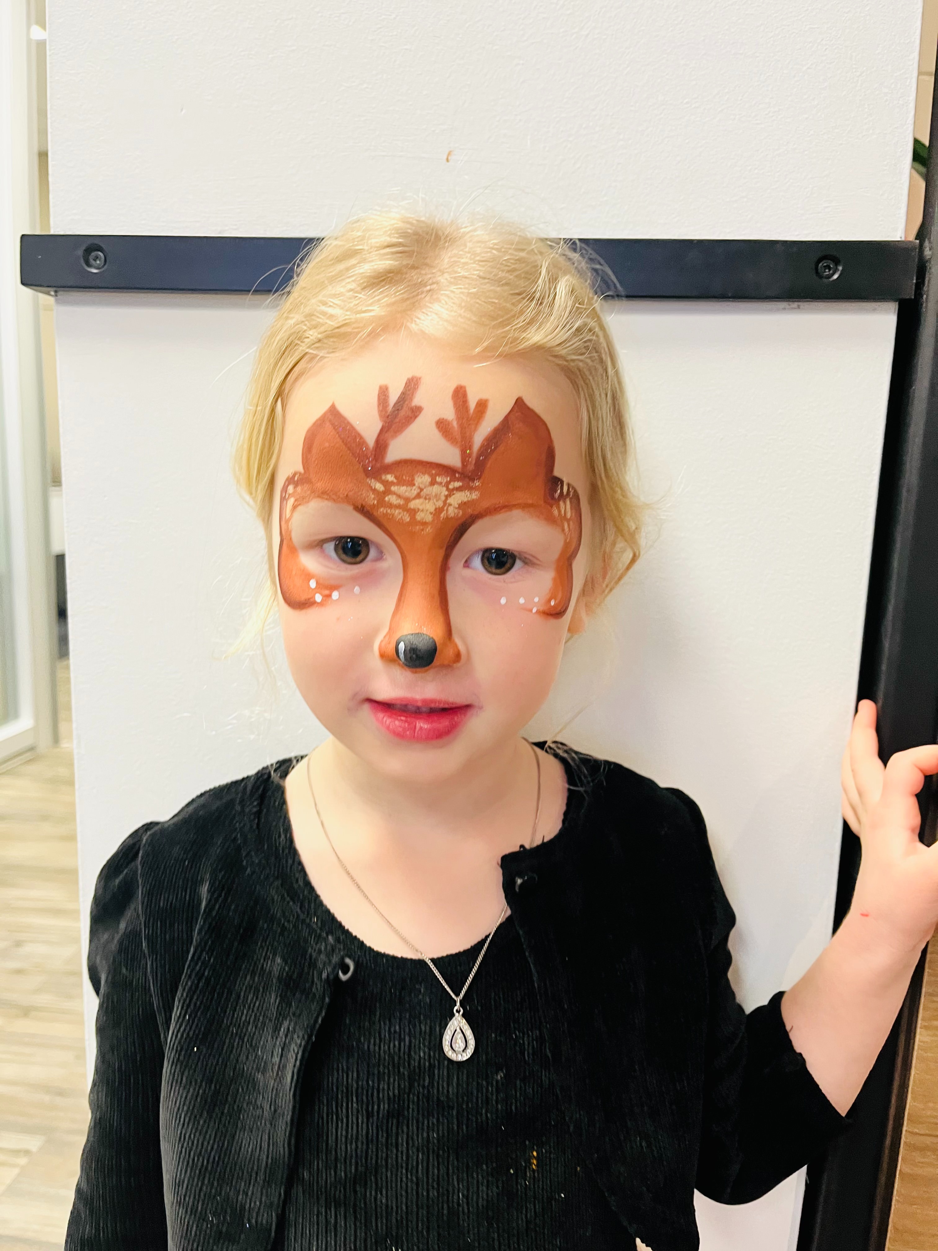 Girl with deer face paint
